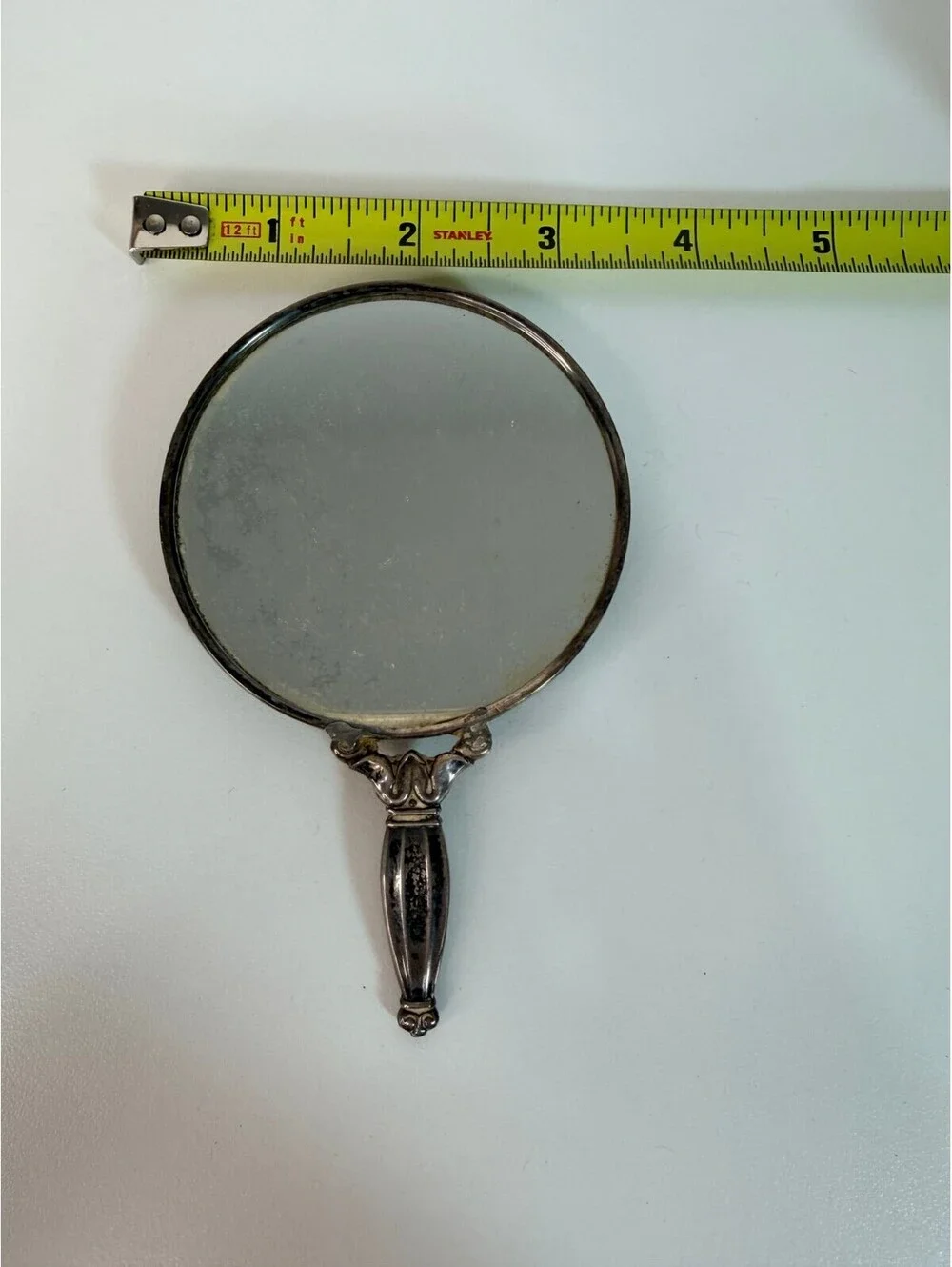 Vintage antique silver tone hand mirror with engraved sunburst back